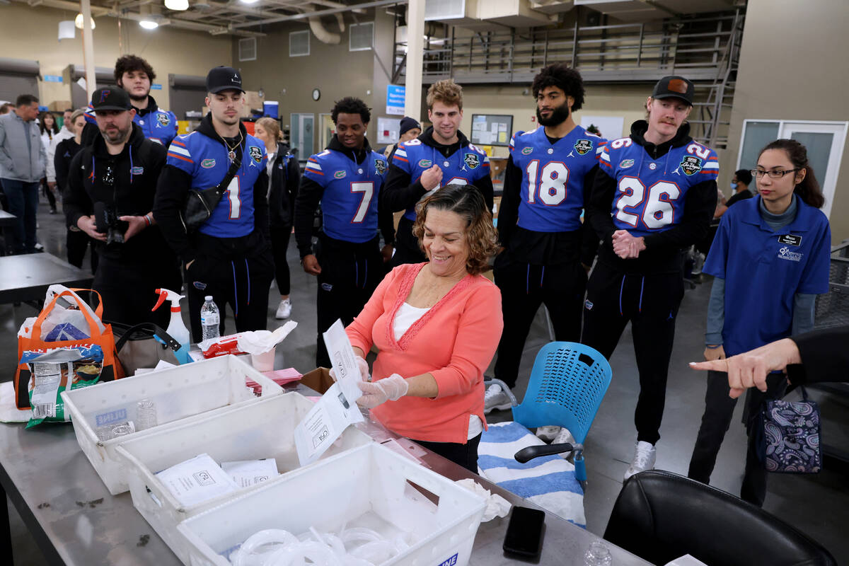 University of Florida football players take a tour of Opportunity Village’s Engelstad ca ...