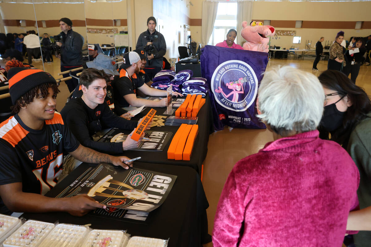 Oregon State players, including defensive back Carlos Mack Jr. (16) and wide receiver Trent Wal ...