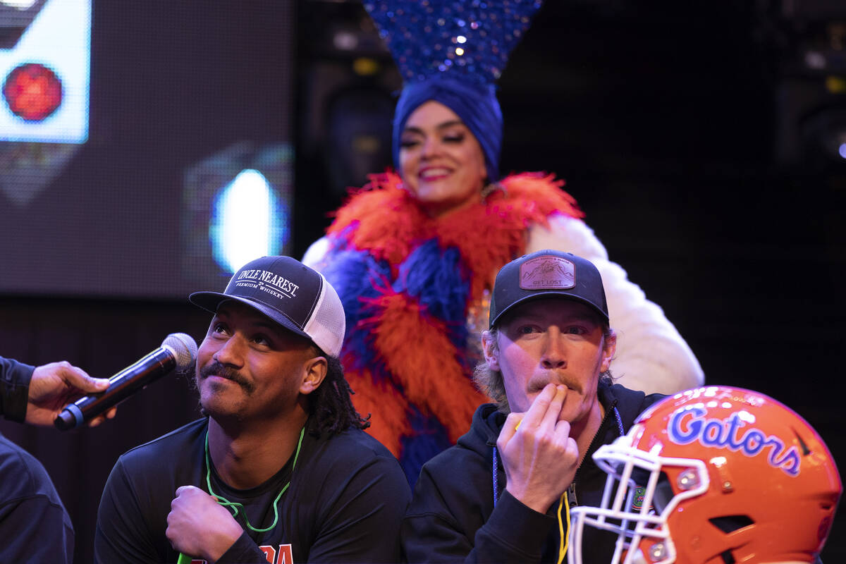 Florida players Jordan Pouncey, left, and Jeremy Crawshaw, right, play Family Feud during a wel ...