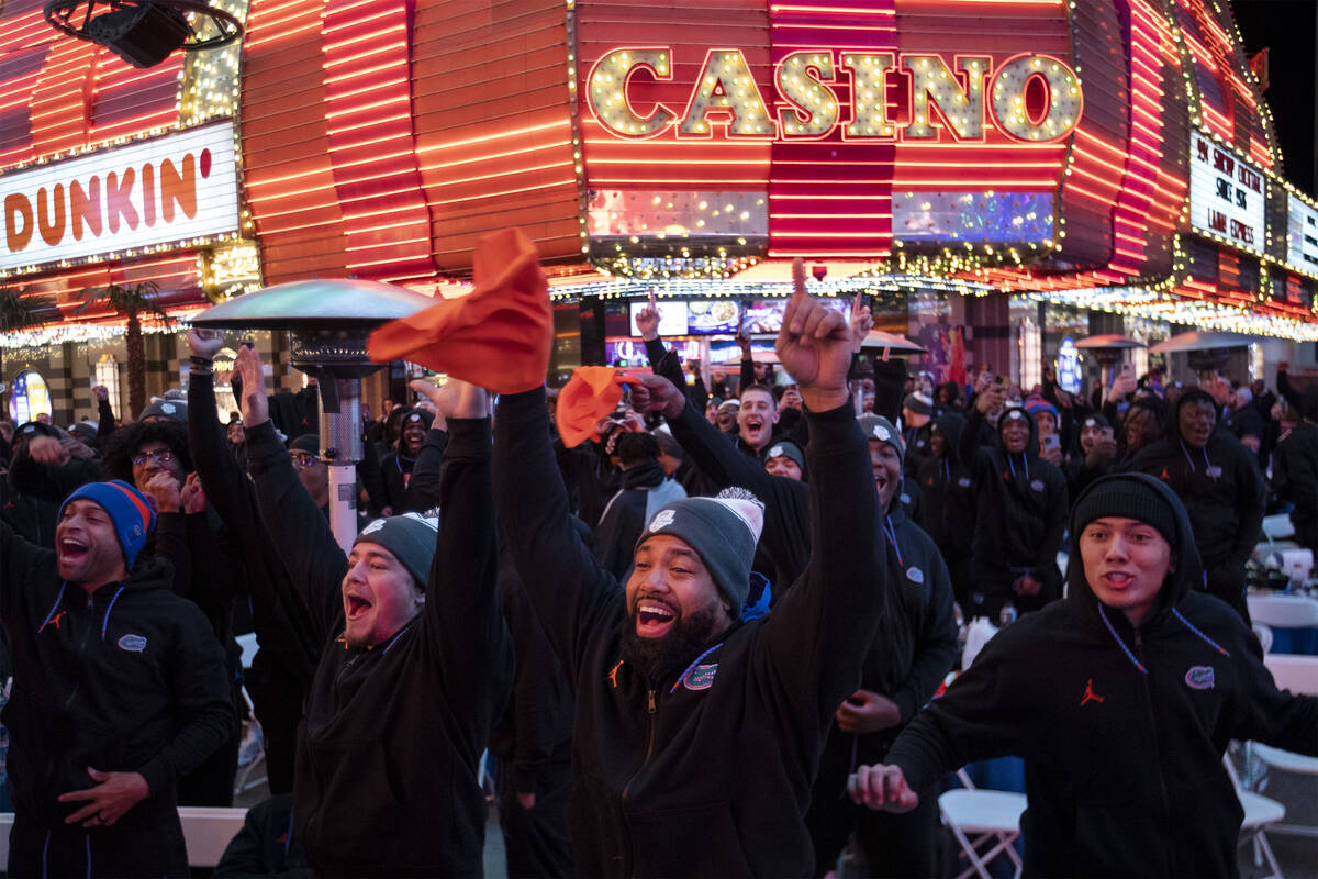 Florida players go wild for their team as they play a game of Family Feud during a welcome rece ...