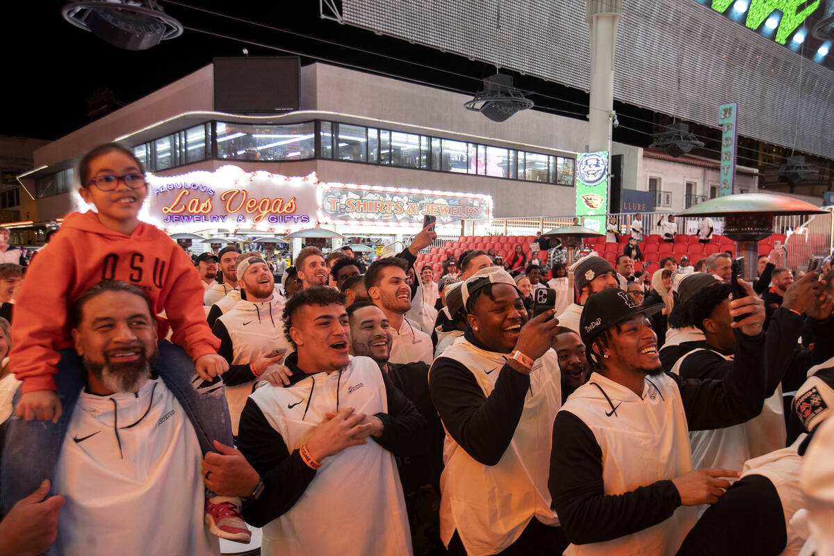 Oregon State players cheer for their teammates in a dance-off during a welcome reception ahead ...