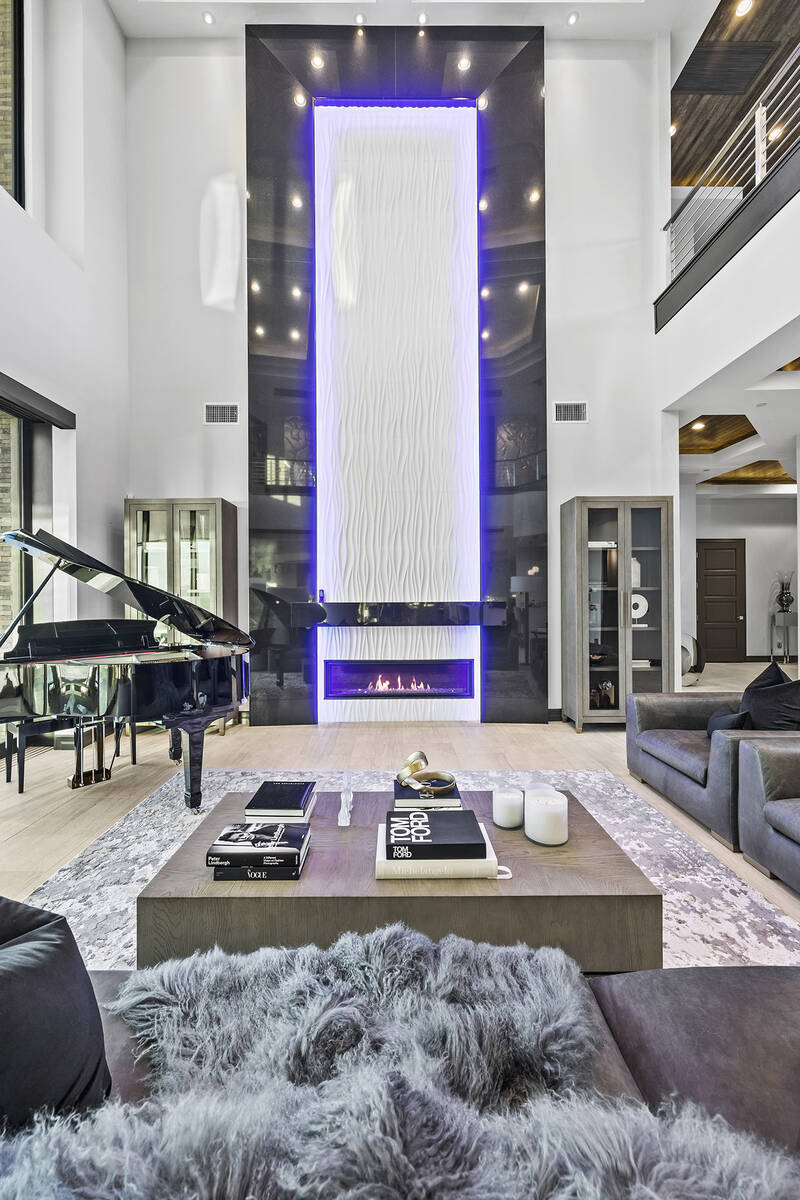 The main living area features a two-story wall above the fireplace. (Douglas Elliman, Nevada)