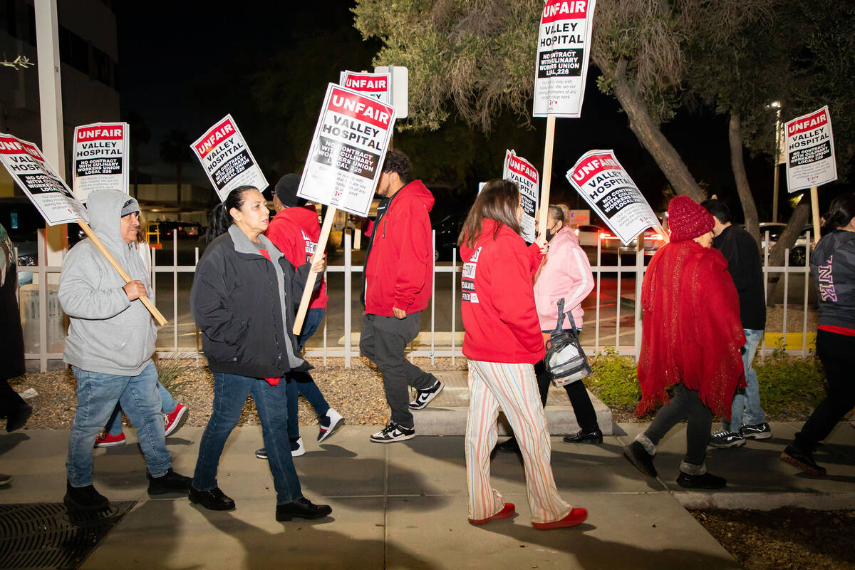 Culinary Union workers are picketing outside Valley Hospital on Thursday, Dec. 15, 2022 in Las ...