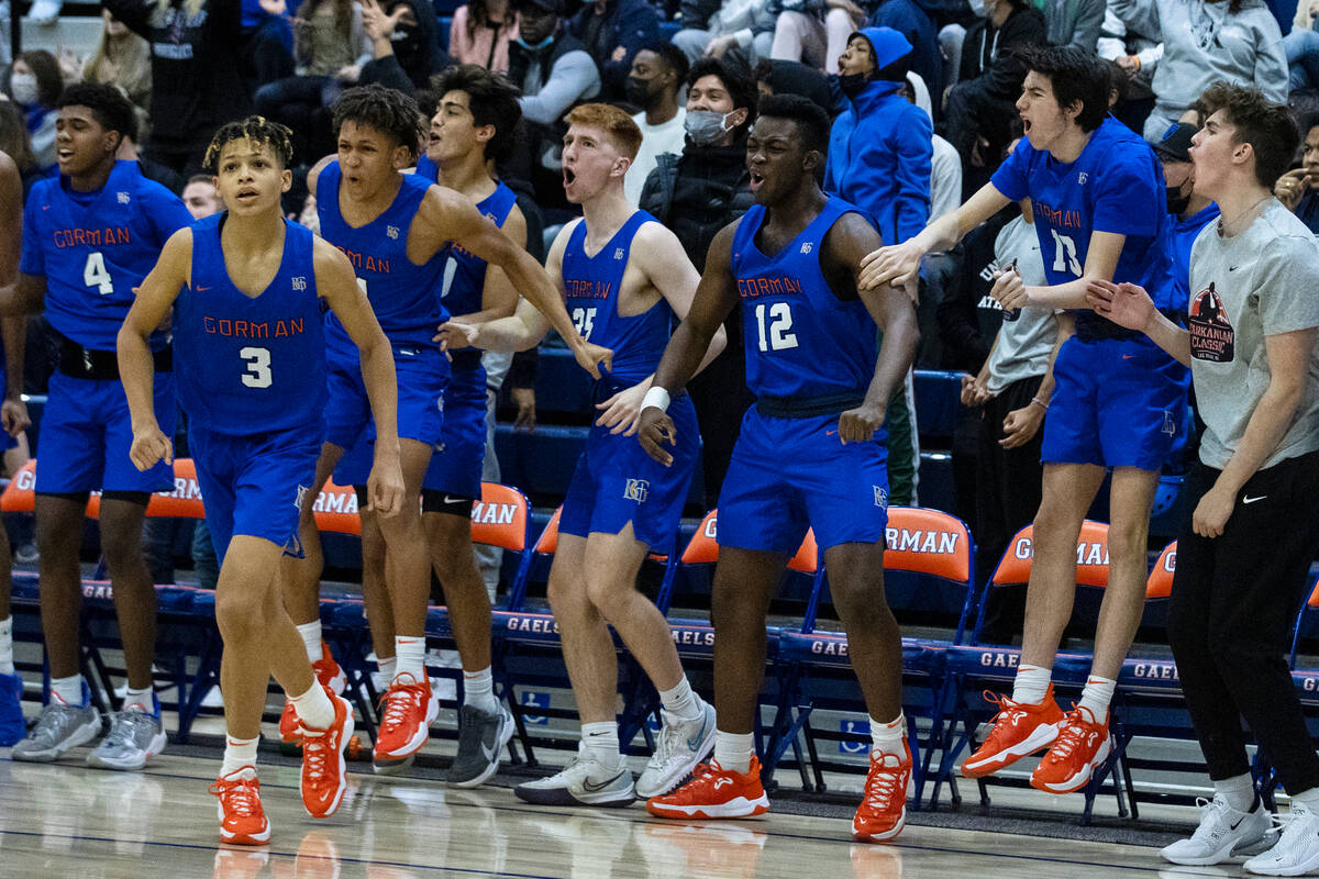 Bishop Gorman players celebrate their win in double overtime against Liberty High during Platin ...
