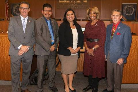 North Las Vegas Councilwoman Ruth Garcia Anderson, center, is surrounded by the rest of the Cit ...