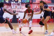 Pepperdine's Theresa Grace Mbanefo (0) and Jane Nwaba (10) defend against UNLV's Desi-Rae Young ...