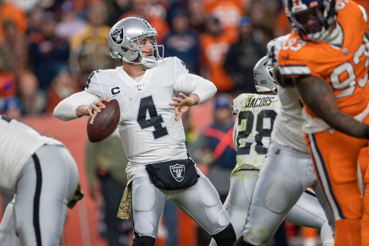 Raiders quarterback Derek Carr (4) throws against the Denver Broncos during the second half of ...
