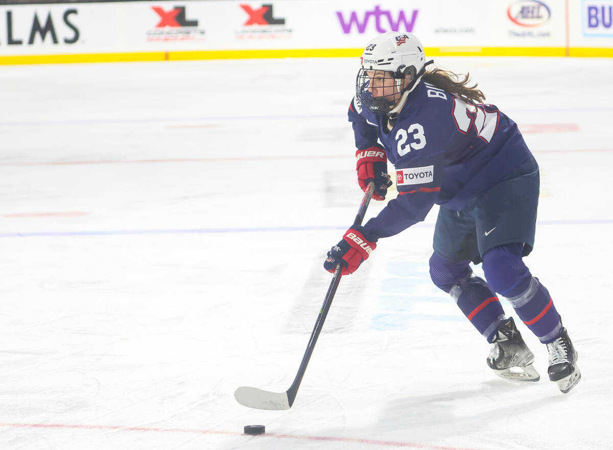 United States' Hannah Bilka skates with the puck during the first period of a rivalry hockey ga ...