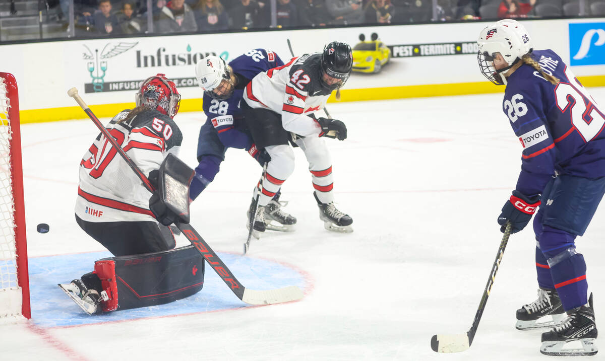 United States' Amanda Kessel (28) scores a goal past Canada goaltender Kristen Campbell on a pa ...