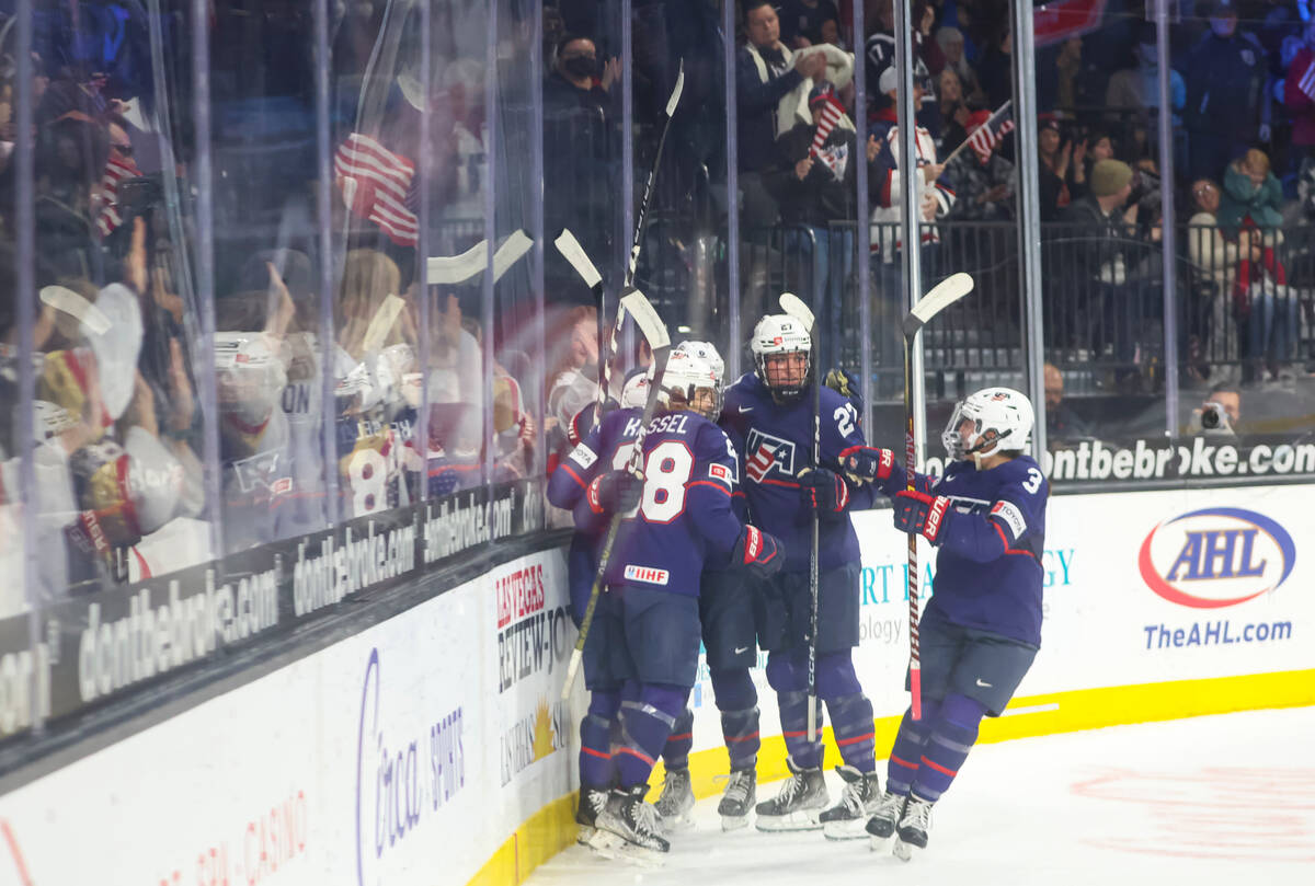 The United States celebrates after scoring against Canada during the first period of a rivalry ...