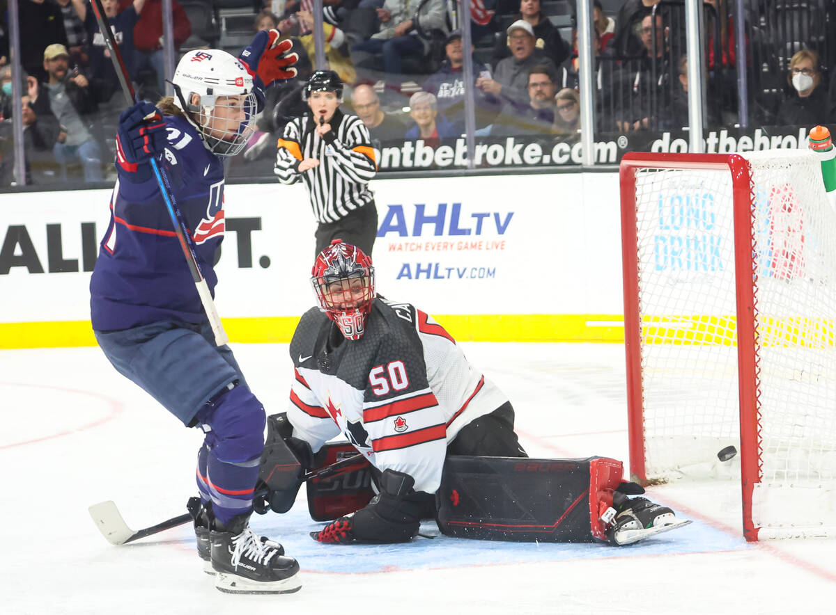 United States' Hilary Knight (21) scores a goal against Canada goaltender Kristen Campbell (50) ...