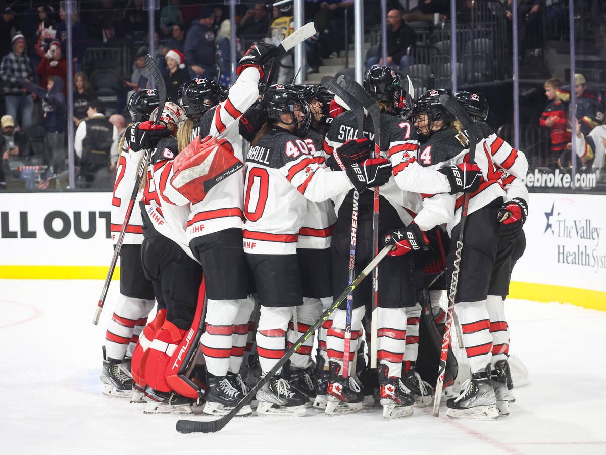 Canada celebrates after defeating the United States in a rivalry hockey game at the Dollar Loan ...