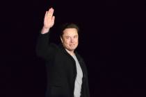 FILE - SpaceX's Elon Musk waves while providing an update on Starship, on Feb. 10, 2022, near B ...
