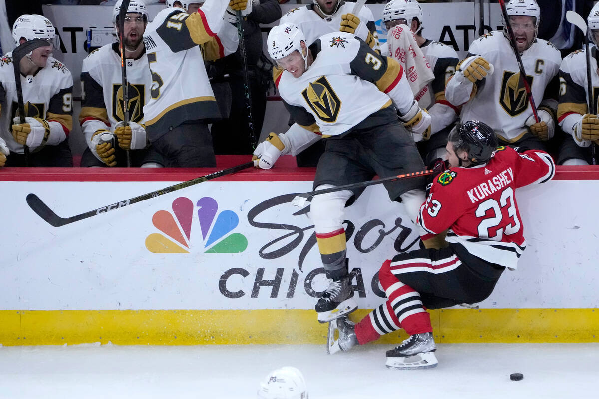 Vegas Golden Knights' Brayden McNabb (3) and Chicago Blackhawks' Philipp Kurashev collide in fr ...