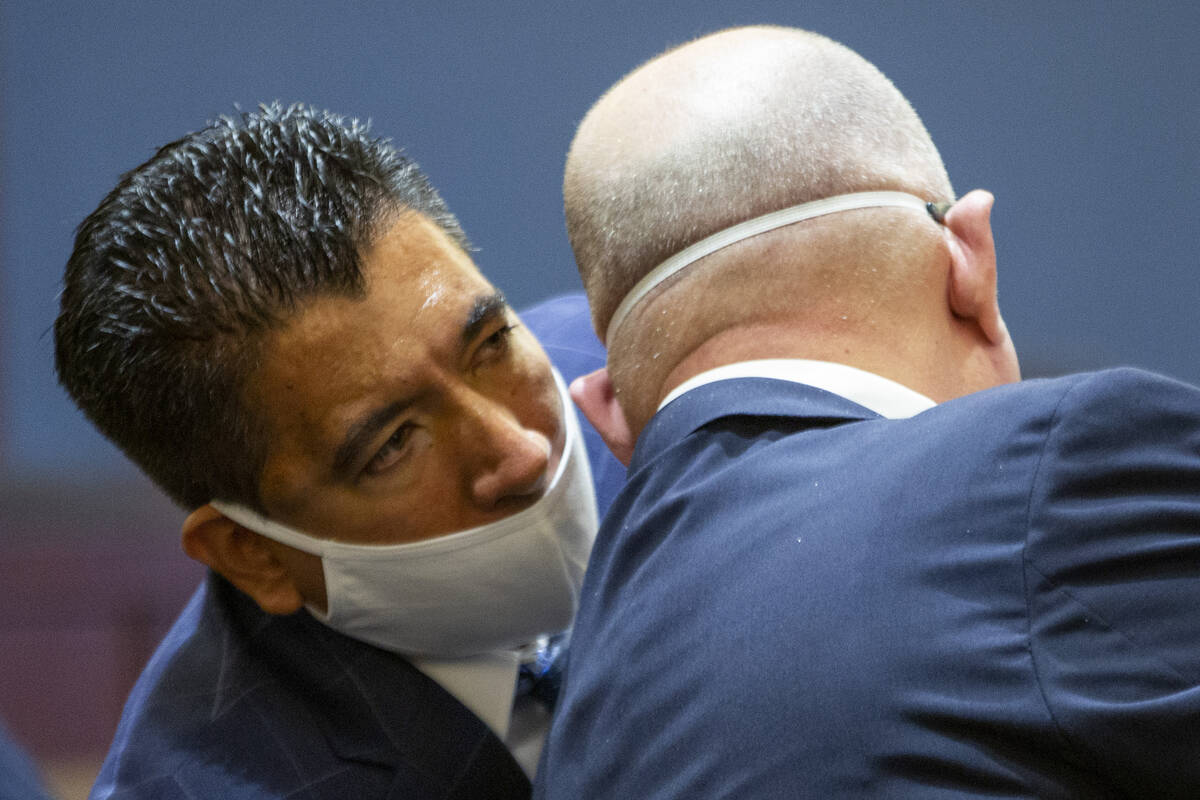 Alpine Motel Apartments owner Adolfo Orozco speaks to attorney Dominic Gentile during a continu ...