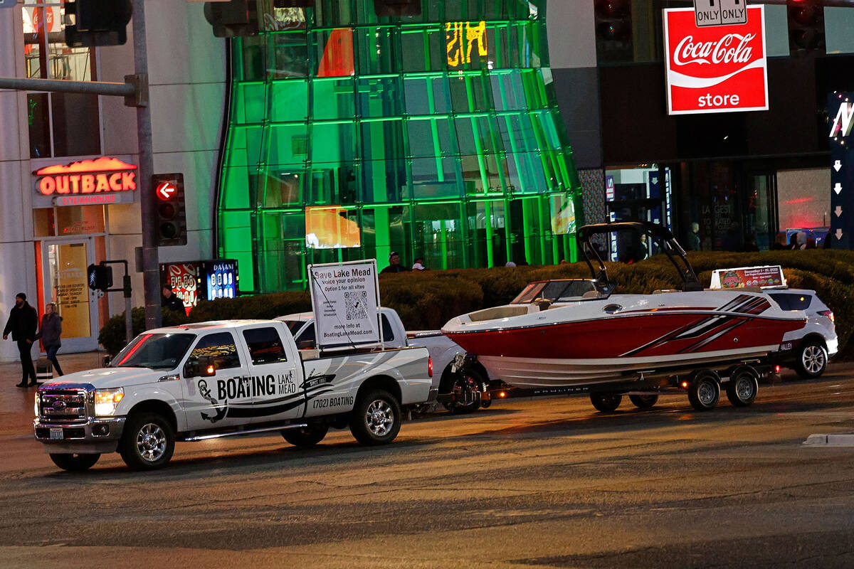 A trailer with a boat shows a sign that reads, “ Save Lake Mead,” Friday, Dec. 16 ...