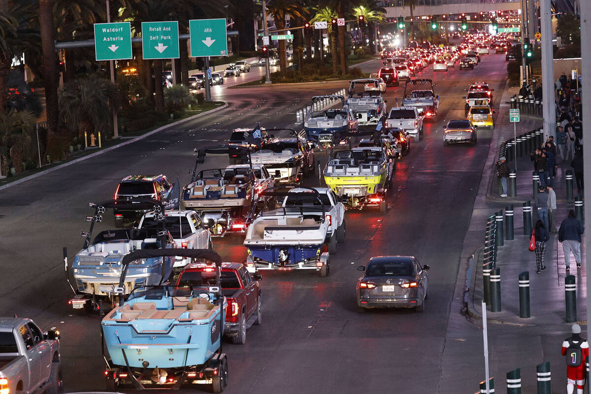 A parade of boats takes place on the Las Vegas Strip, Friday, Dec. 16, 2022, as boating enthusi ...