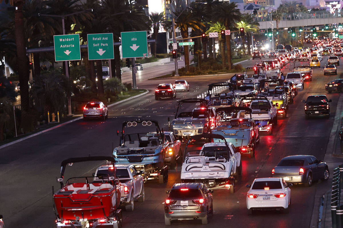 A parade of boats takes place on the Las Vegas Strip, Friday, Dec. 16, 2022, as boating enthusi ...