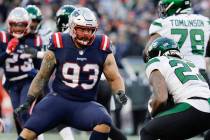 New England Patriots' Lawrence Guy eyes a New York Jets runner during an NFL football game at G ...