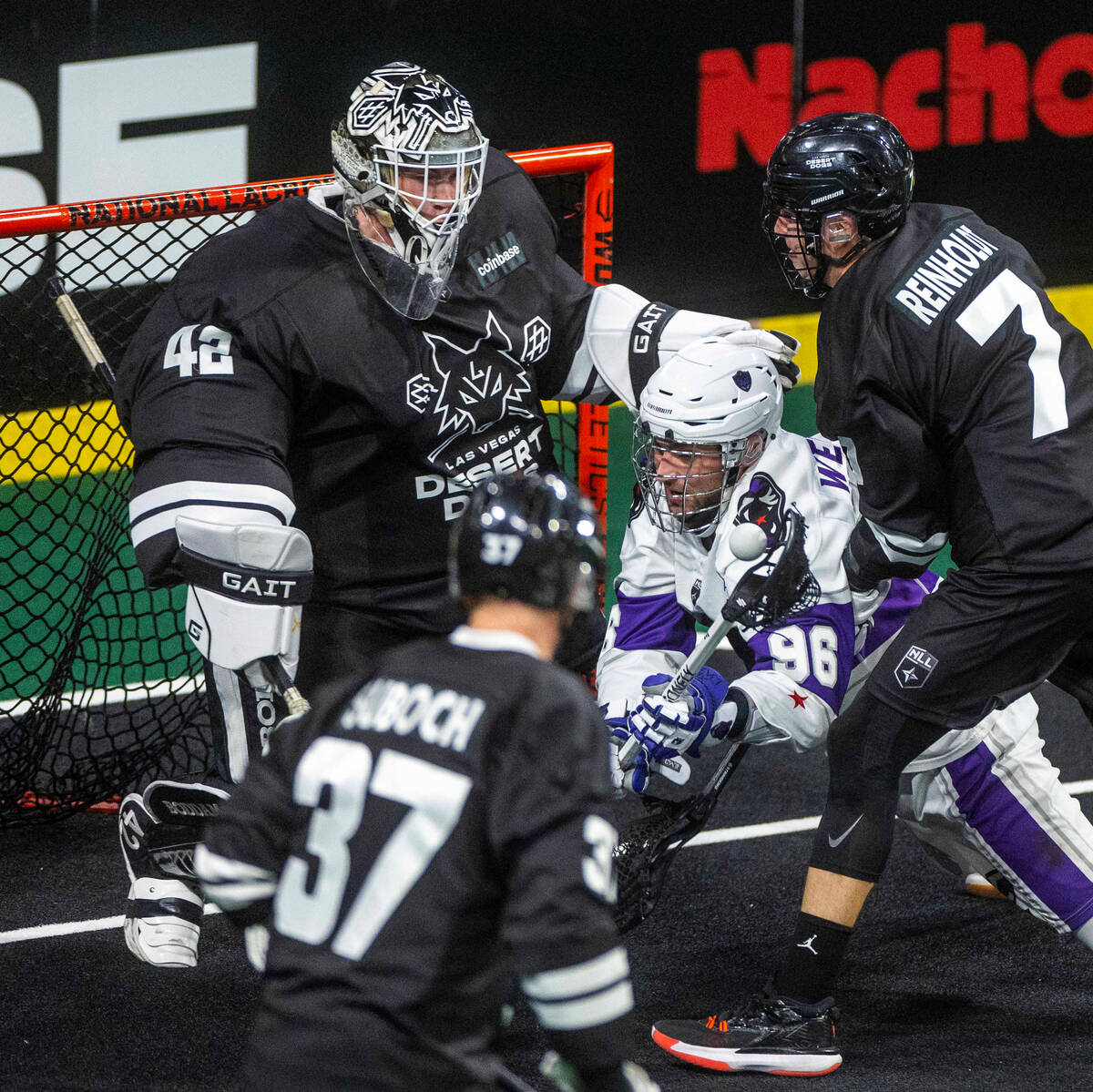 Desert Dogs goalie Landon Kells (42) rejects a shot by Panther City forward Cameron Wengreniuk ...