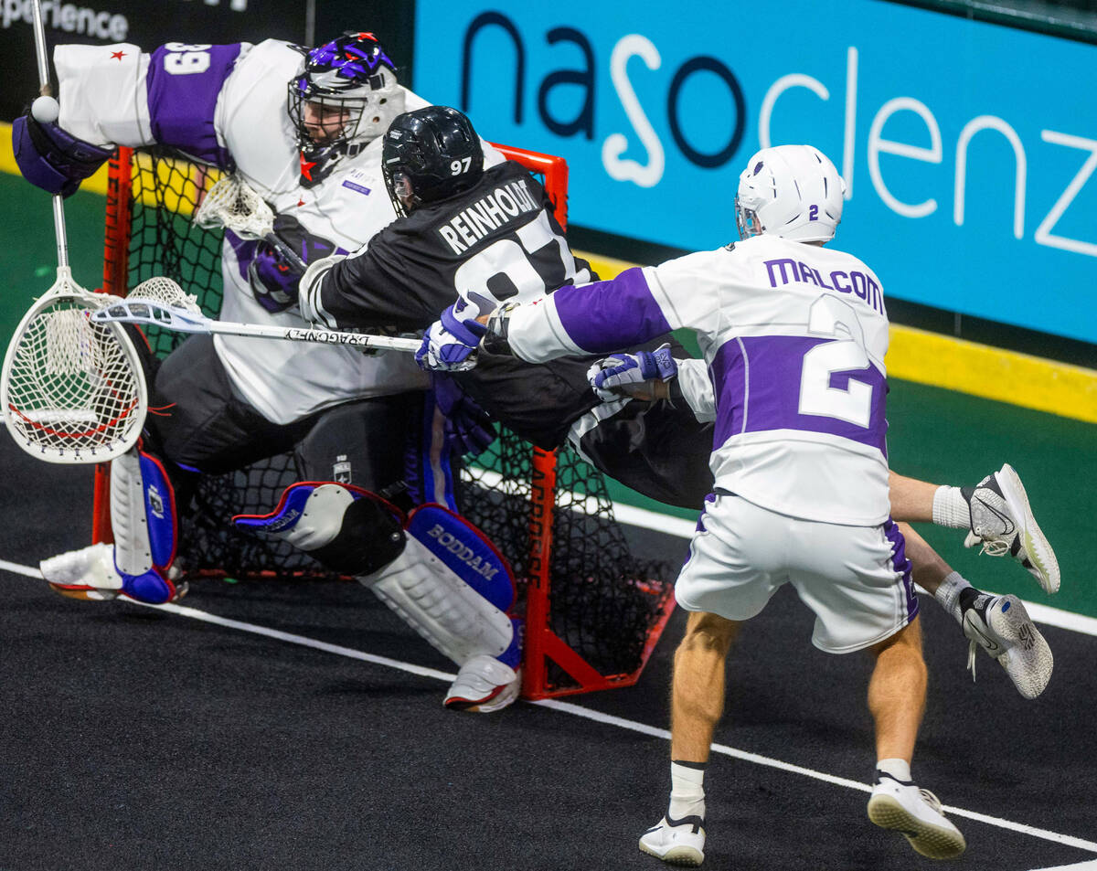 Desert Dogs forward Reid Reinholdt (97) leaps on a shot attempt versus Panther City goalie Nick ...