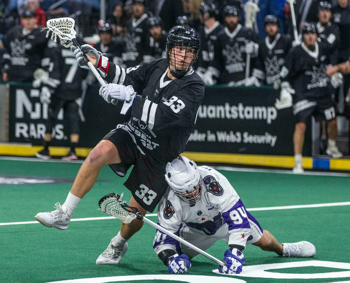 Desert Dogs forward Jack Hannah (33) readies to shoot as Panther City defender Matt Hossack (94 ...