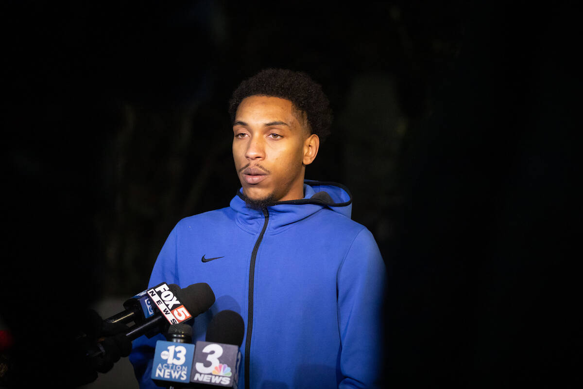 Tavon Wilmer, 22, gives an interview to local media outlets during a candlelight vigil for his ...