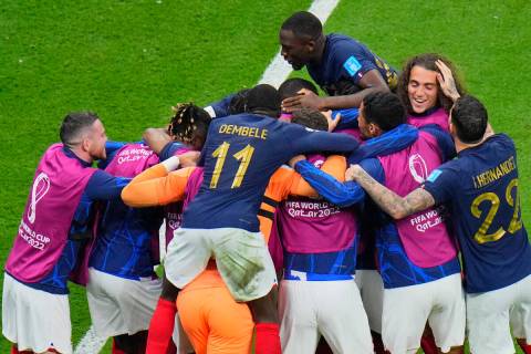 French players celebrate during the World Cup semifinal soccer match between France and Morocco ...