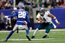 Philadelphia Eagles quarterback Jalen Hurts (1) runs with the ball against the New York Giants ...