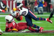 Arizona Cardinals linebacker Myjai Sanders (41) tackles New England Patriots running back Rhamo ...