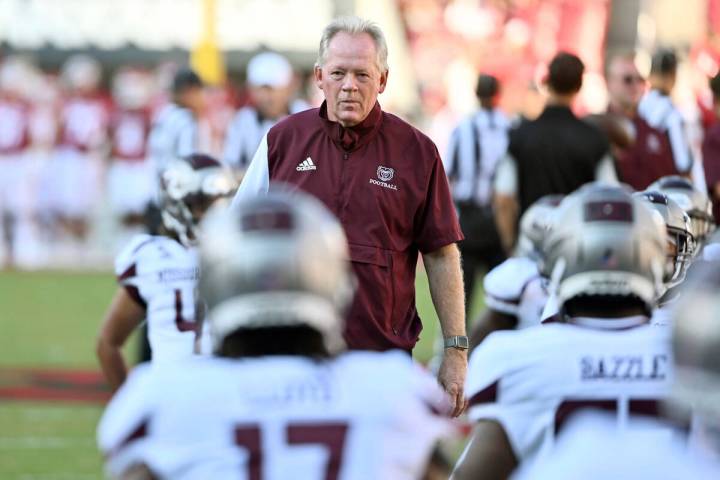 Missouri State coach Bobby Petrino watches his team warm up before playing Arkansas before an N ...