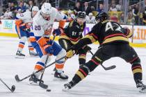 Vegas Golden Knights defenseman Daniil Miromanov (42) defends against New York Islanders right ...