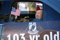 U.S. Army Air Corps veteran and ex-POW Vincent Shank, 103, takes part in the Veterans Day Parad ...
