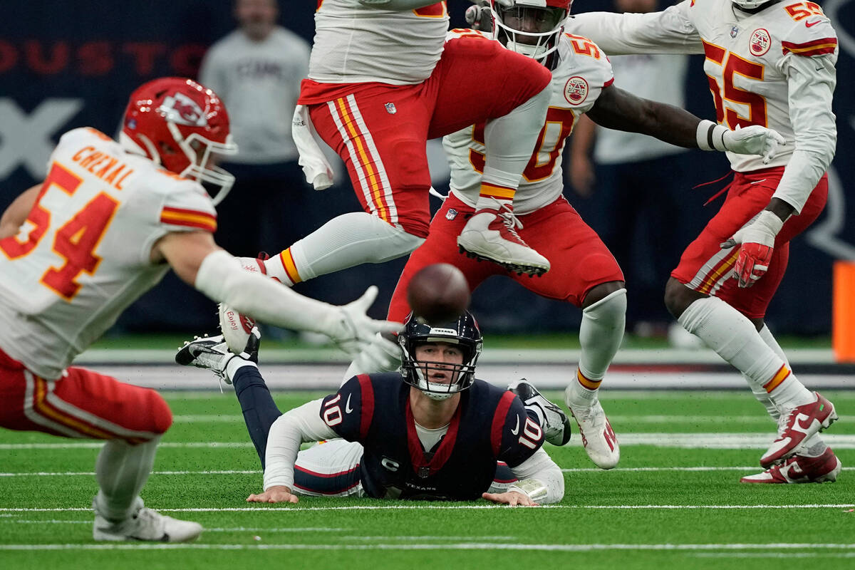 Houston Texans quarterback Davis Mills (10) fumble the ball during overtime in an NFL football ...