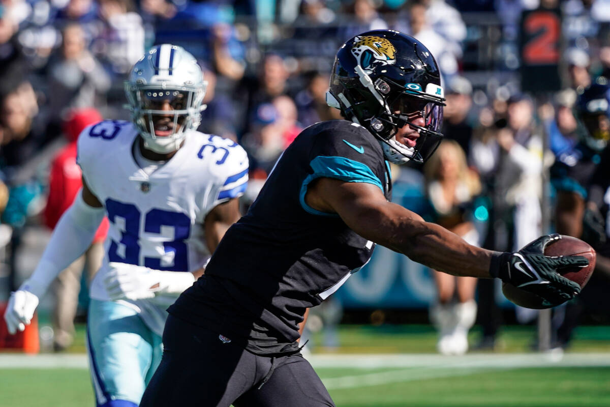 Jacksonville Jaguars wide receiver Zay Jones (7) scores a touchdown during the first half of an ...