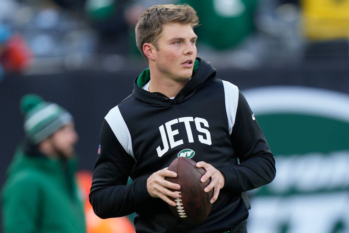 New York Jets quarterback Zach Wilson warms up before playing against the Detroit Lions in an N ...