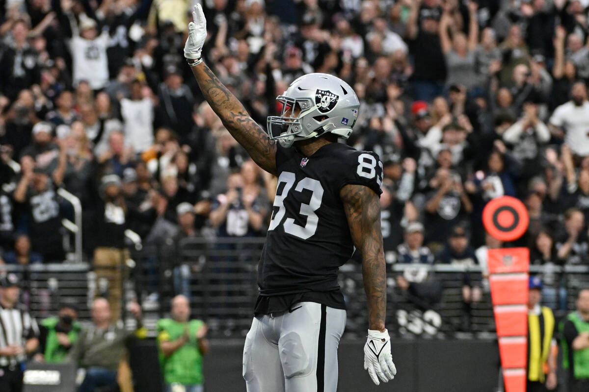 Las Vegas Raiders tight end Darren Waller waves to fans after scoring on a 25-yard pass during ...