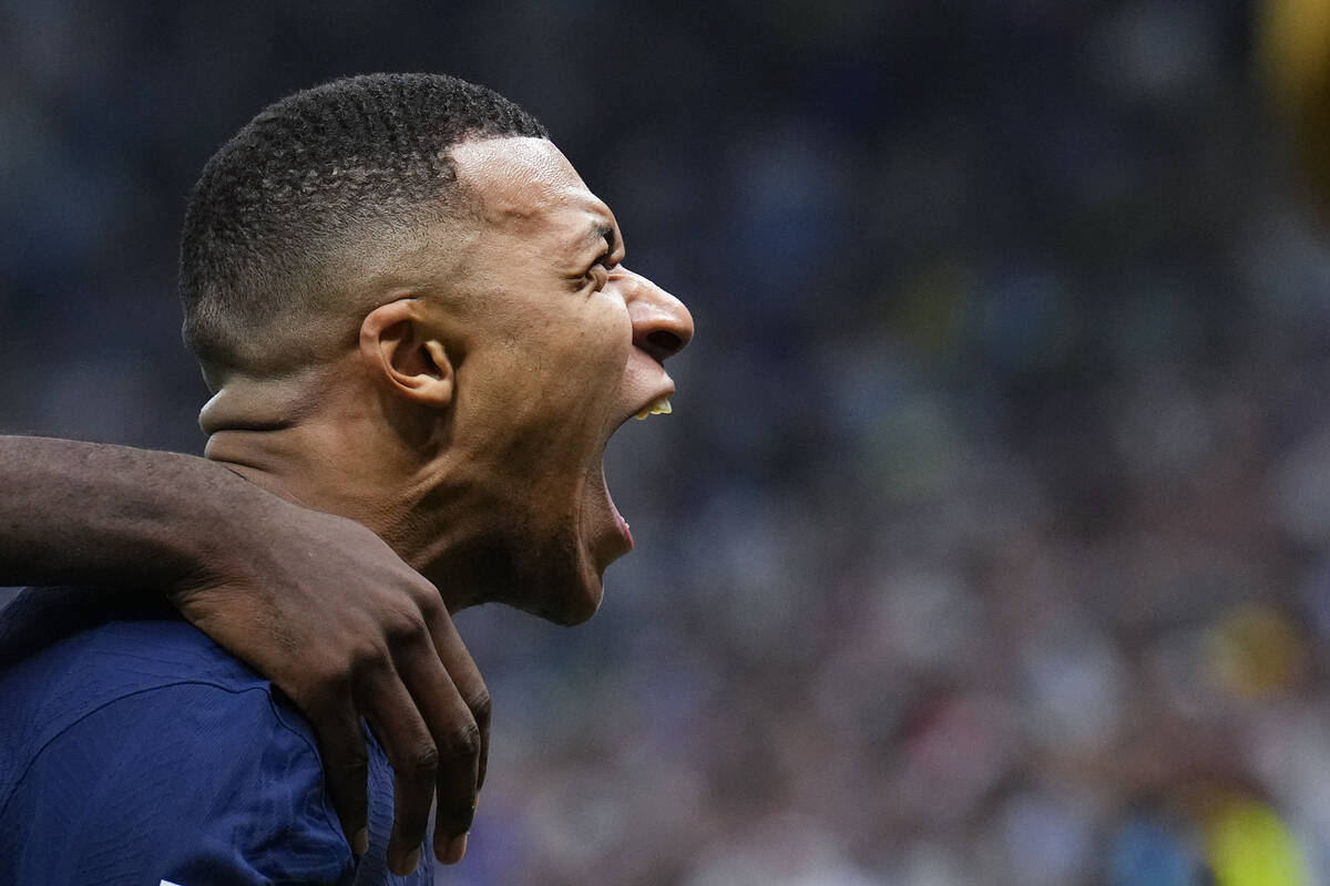 France's Kylian Mbappe celebrates scoring his side's second goal during the World Cup final soc ...