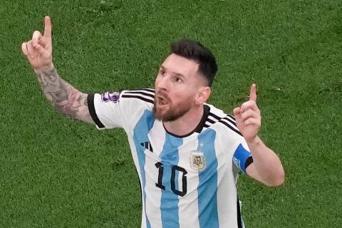 Argentina's Lionel Messi celebrates scoring his side's first goal during the World Cup final so ...