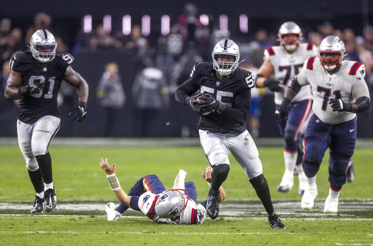 Raiders defensive end Chandler Jones (55) breaks away from tackle attempt by New England Patrio ...