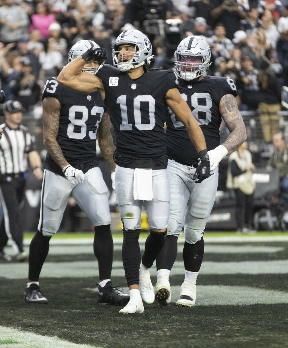 Raiders wide receiver Mack Hollins (10) flexes after scoring a touchdown during the first half ...