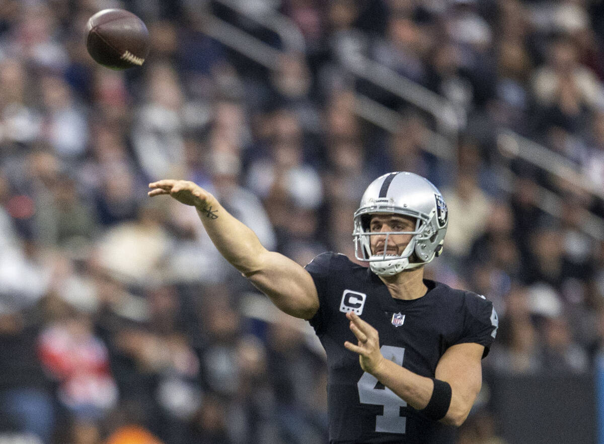 Raiders quarterback Derek Carr (4) throws against the New England Patriots during the first hal ...