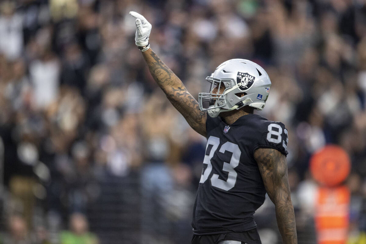 Raiders tight end Darren Waller (83) scores a touchdown during the first half of an NFL game ag ...