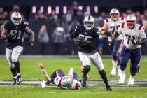 Raiders defensive end Chandler Jones (55) breaks away from tackle attempt by New England Patrio ...