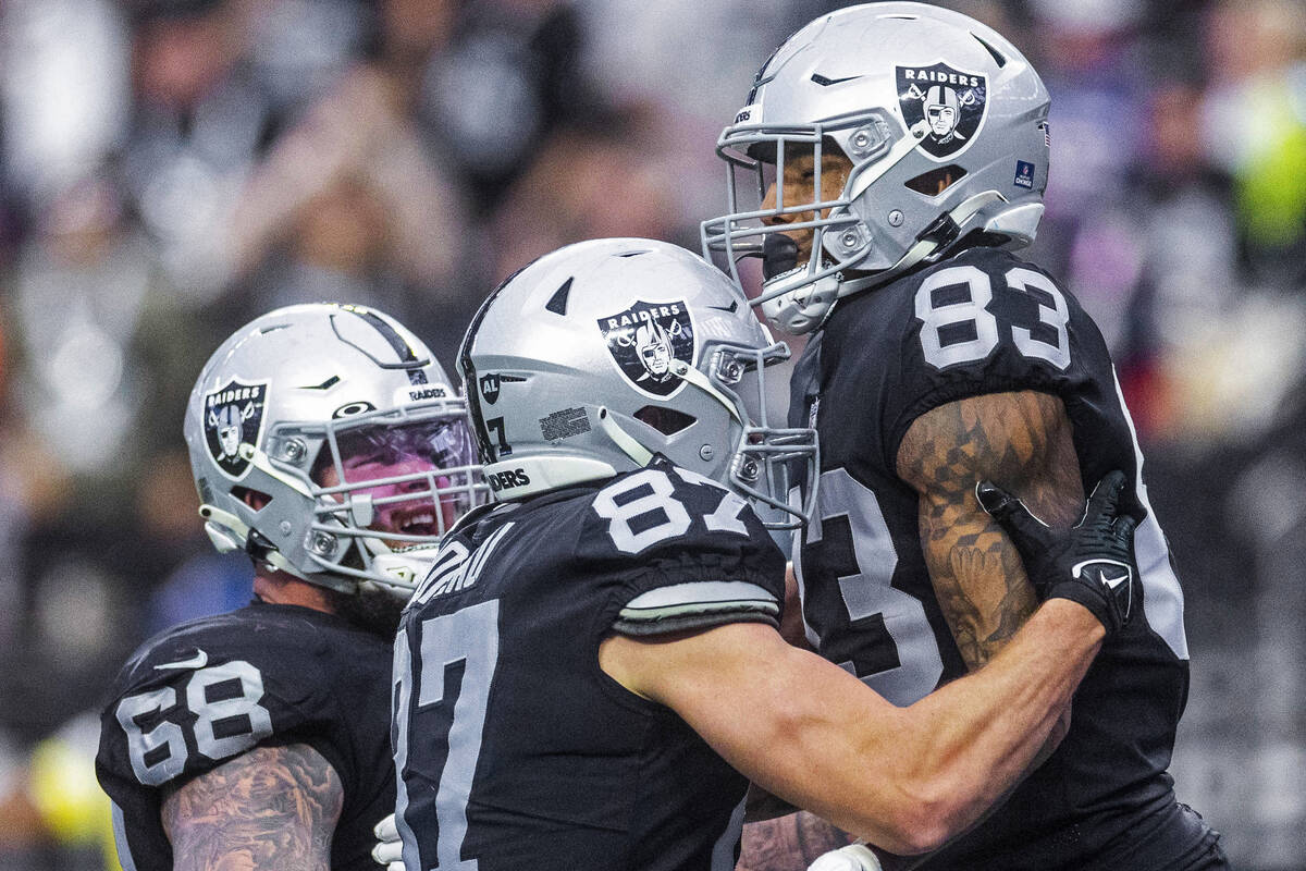Raiders tight end Darren Waller (83) celebrates a touchdown catch with teammate tight end Foste ...