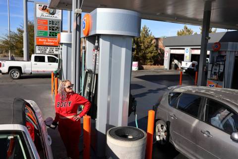 Jennifer Campbell of Las Vegas fills her gas tank for $3.39 a gallon at a 76 station on South B ...