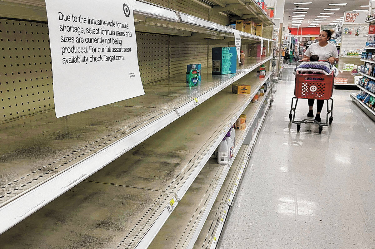 A woman shops for baby formula at Target in Annapolis, Maryland, on May 16, 2022, as a nationwi ...