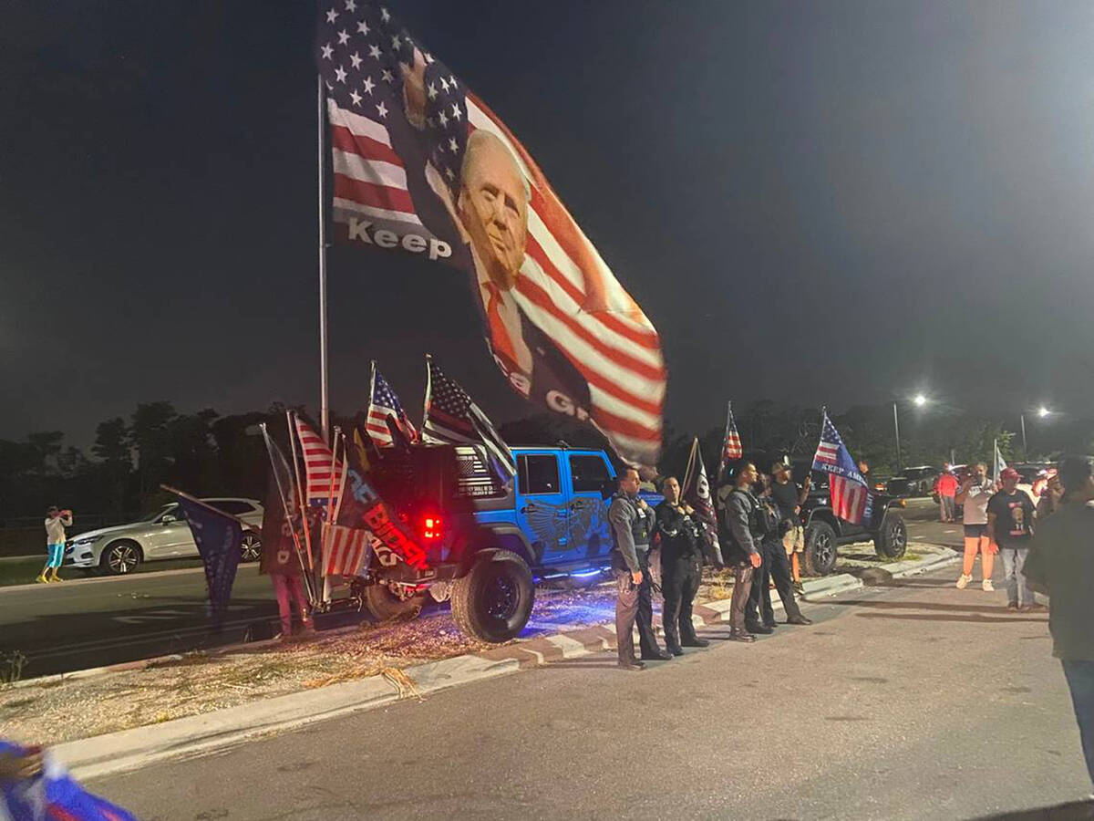Police standby at the approach to Mar-a-Lago in Palm Beach on Monday night, Aug. 9, 2022, as su ...