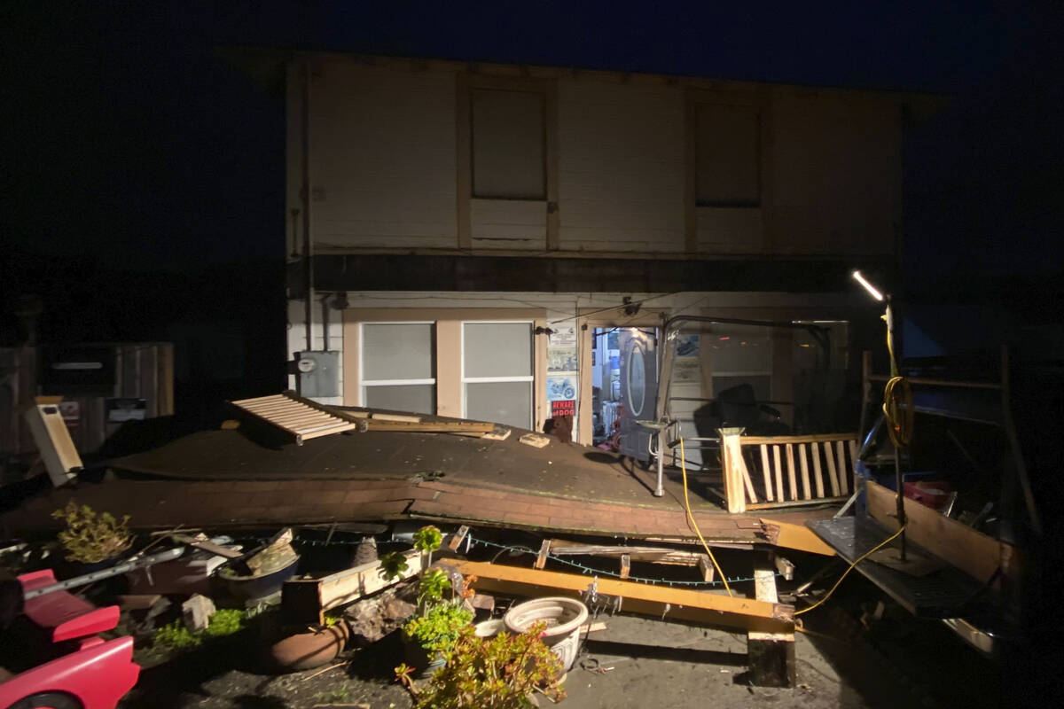 Earthquake damage is seen outside a building in Rio Dell, Calif., Tuesday, Dec. 20, 2022. A str ...