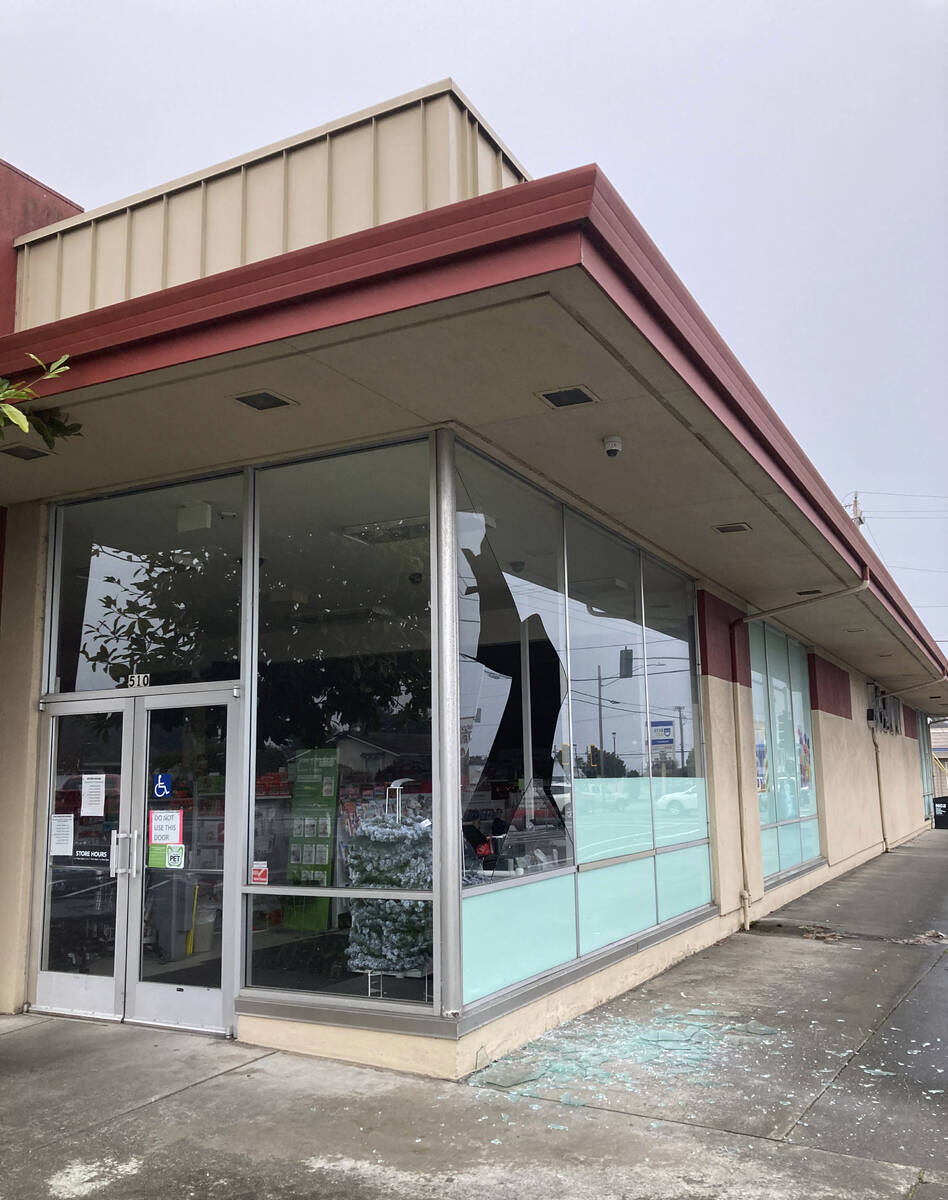 A shattered window is seen at JoAnn Fabrics following an earthquake in Eureka, Calif., Tuesday, ...